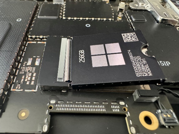 Screenshot that shows inserting the connector end of the removable SSD into the motherboard while keeping the drive nearly horizontal.