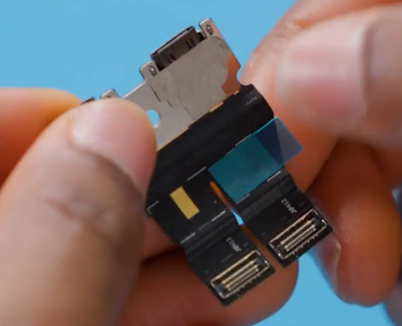 Photo that shows applying PSA to the back of a USB-C FPC module using alignment marks.