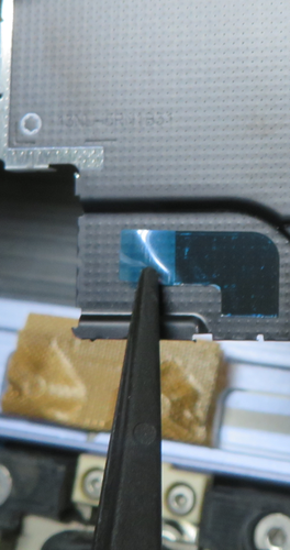 Photo that shows a close-up of a black adhesive sticker used for shielding.