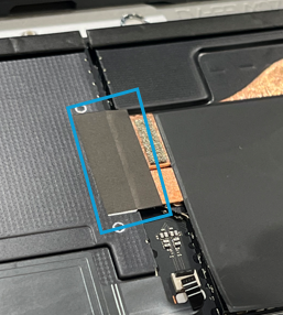 Foam swab cleaning thermal paste off a central chip on a circuit board before applying Conductive Tape 1.